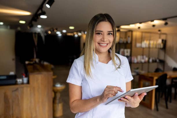 Professional using a tablet at a reception desk